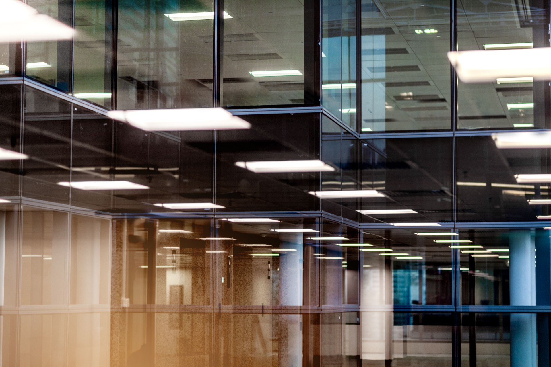 Abstract reflection of business office buildings in glass window in downtown urban area